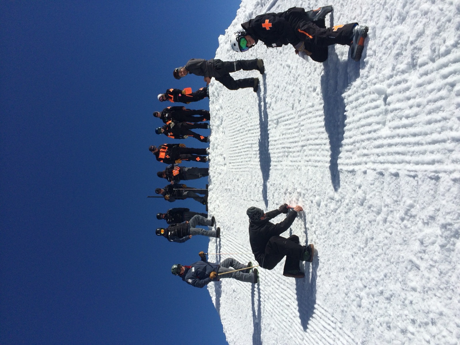 Crew measuring a jump feature on site